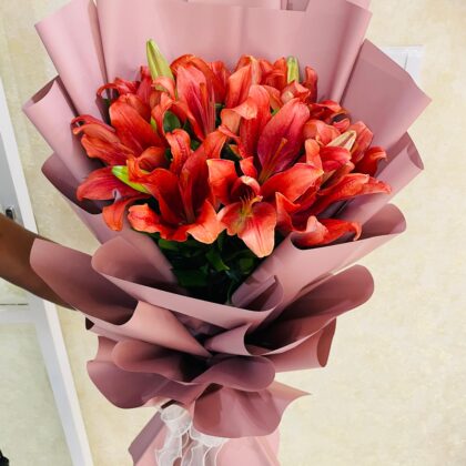 Elegant Red Lily Bouquet with Blush Pink Wrap